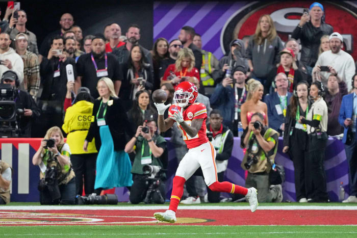 Feb 11, 2024; Paradise, Nevada, USA; Kansas City Chiefs wide receiver Mecole Hardman Jr. (12) makes a game-winning catch for a touchdown against the San Francisco 49ers during overtime of Super Bowl LVIII at Allegiant Stadium.